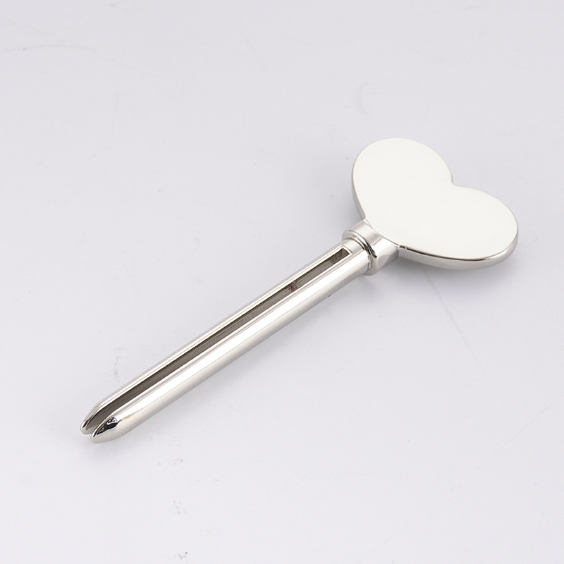 Kovový dávkovač zubní pasty Čisticí prostředek na obličej Lis na tuby na zuby Key Shape Kosmetika na tuby