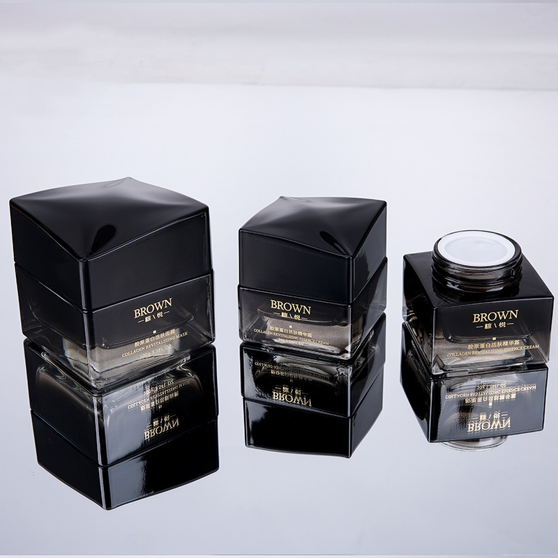 Jedinečná čtvercová skleněná nádoba na smetanu se zvýšeným víčkem pro kosmetické balení Jedinečná čtvercová skleněná nádoba na smetanu se zvýšeným víčkem pro kosmetické balení