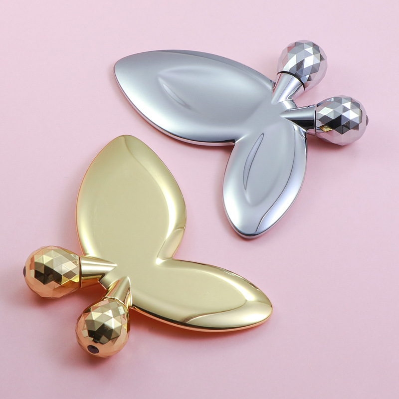 Masážní váleček na obličej ve tvaru motýla ze zinkové slitiny